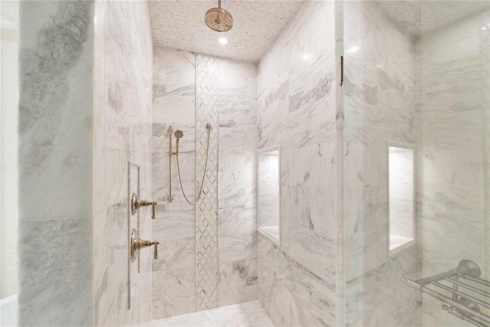 2000 PARK STREET N, St Petersburg, FL 33710 Expansive walk-in shower with modern design and a luxurious, spa-level feel.