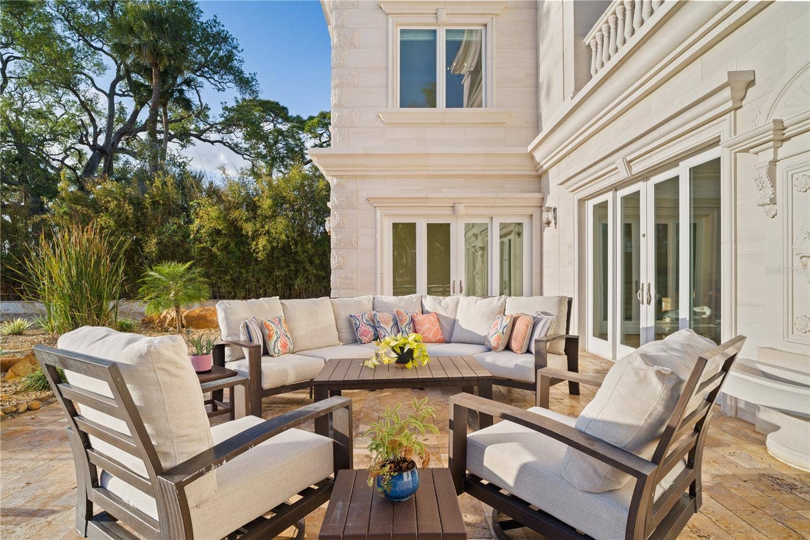 2000 PARK STREET N, St Petersburg, FL 33710 Private patio surrounded by lush landscaping and serene views.