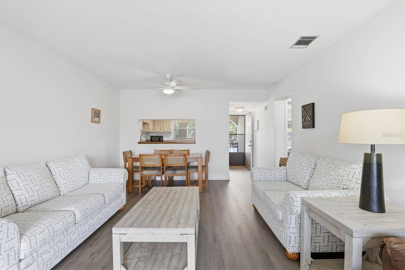 7701 STARKEY ROAD, #412, Seminole, FL 33777 Full view of dining and living room