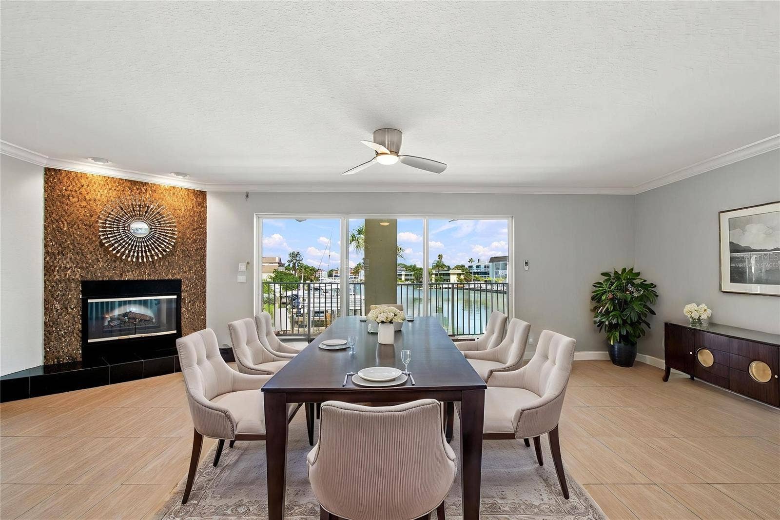 152 117TH AVENUE, Treasure Island, FL 33706 A wood-burning and electric fireplace when you want the ambience, but not the heat. Virtually Staged.