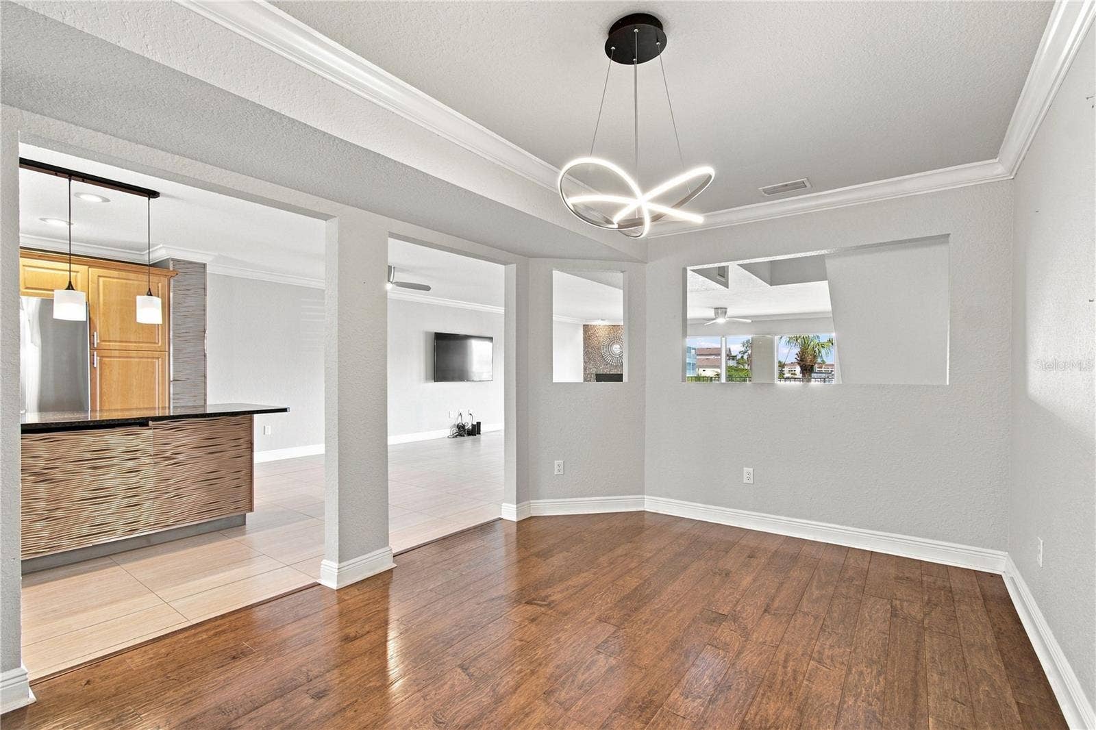 152 117TH AVENUE, Treasure Island, FL 33706 This is a formal dining room or could easily be an amazing office with a view.