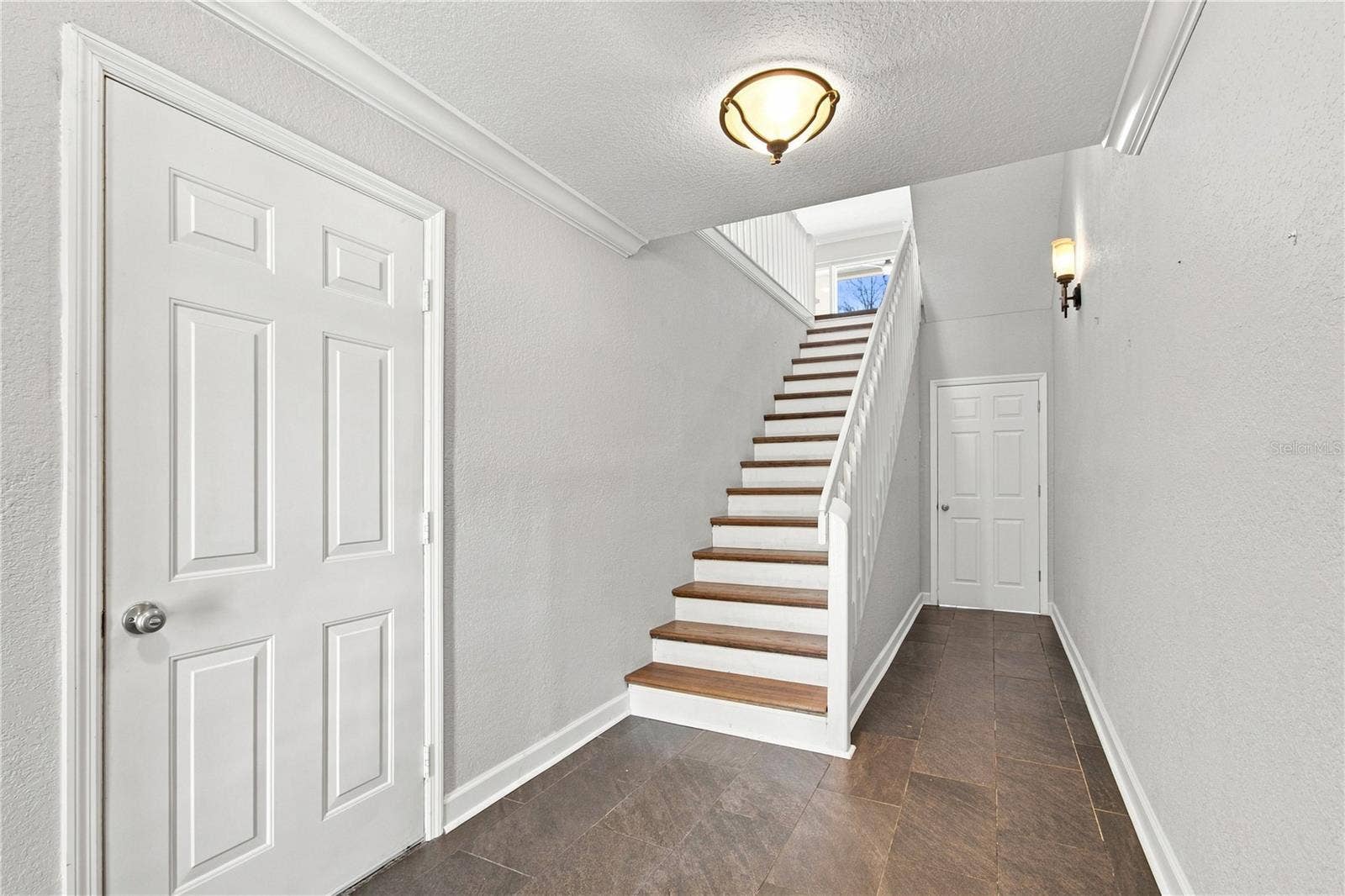 152 117TH AVENUE, Treasure Island, FL 33706 Deep garage and access to the waterfront patio through these doors.