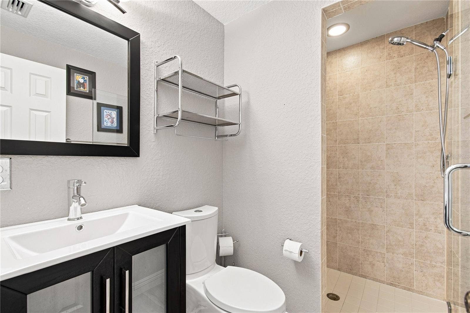 152 117TH AVENUE, Treasure Island, FL 33706 Modern guest bathroom with walk in shower.