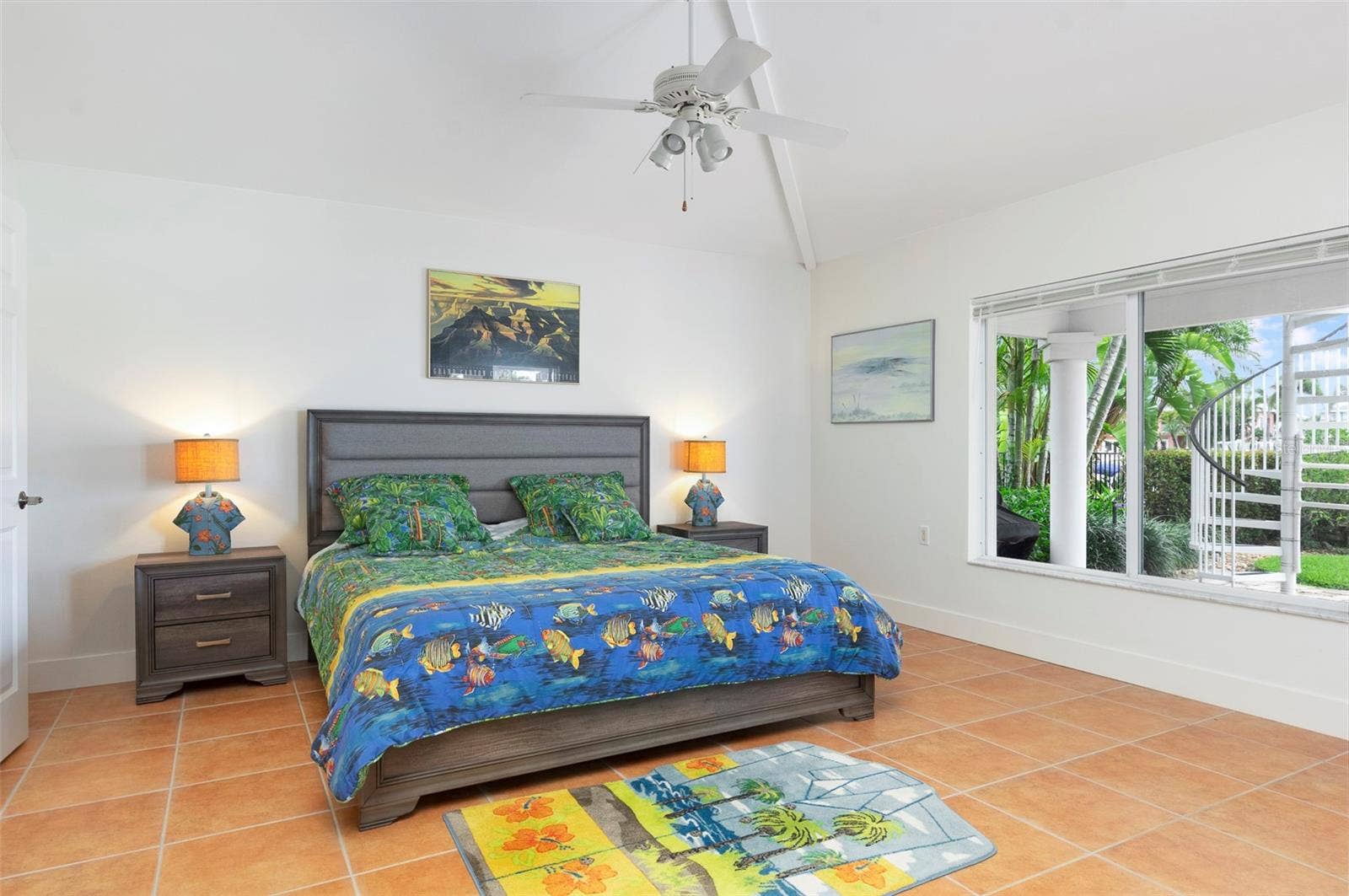 The master bedroom boasts the same spacious tall ceilings & ample natural light