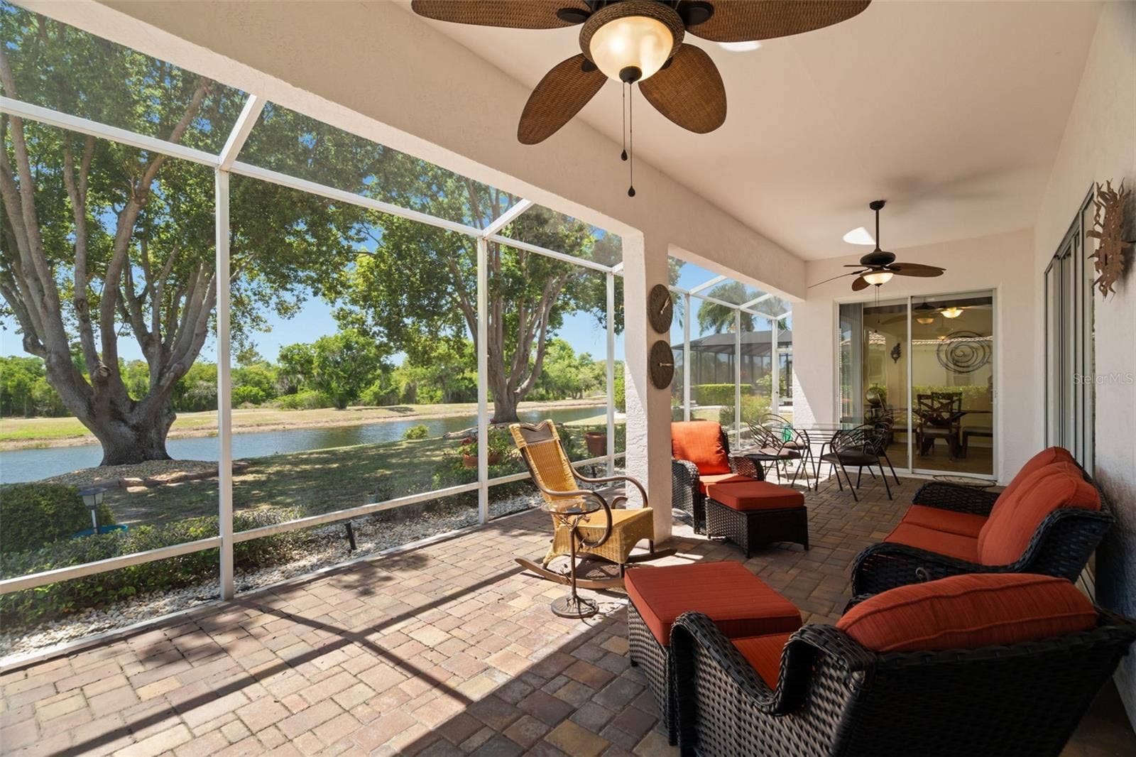1134 SIGNATURE DRIVE, Sun City Center, FL 33573 Oversized Lanai with Golf and Water Views
