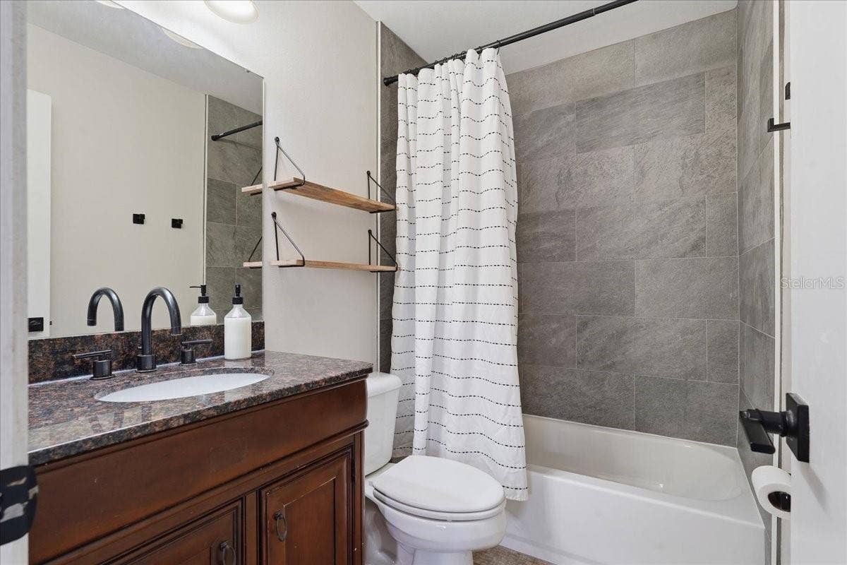 8913 WOOD LAKE COURT, New Port Richey, FL 34653 UPDATED PRIMARY BATHROOM