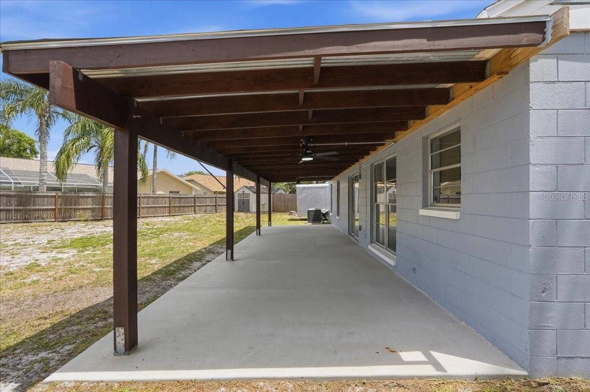 8913 WOOD LAKE COURT, New Port Richey, FL 34653 EXPANSIVE COVERED PATIO