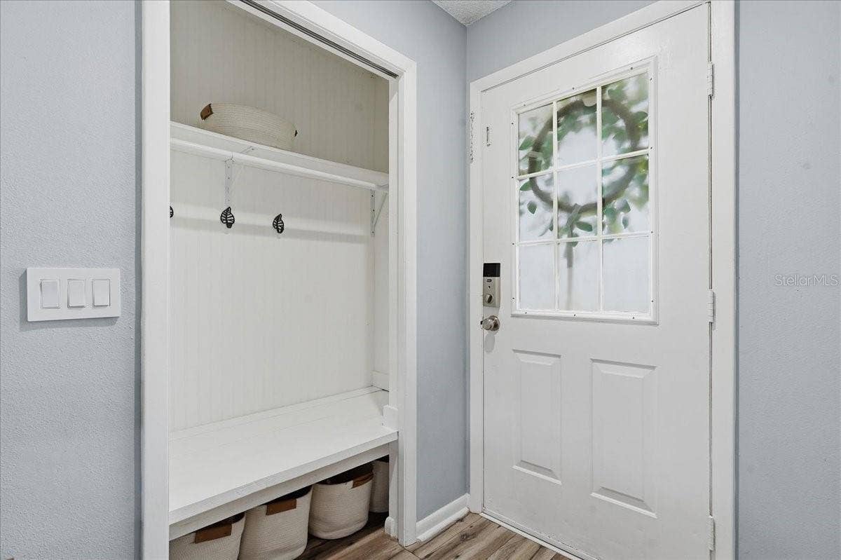 8913 WOOD LAKE COURT, New Port Richey, FL 34653 CUSTOM BUILT MUD ROOM CLOSET IN THE FOYER!