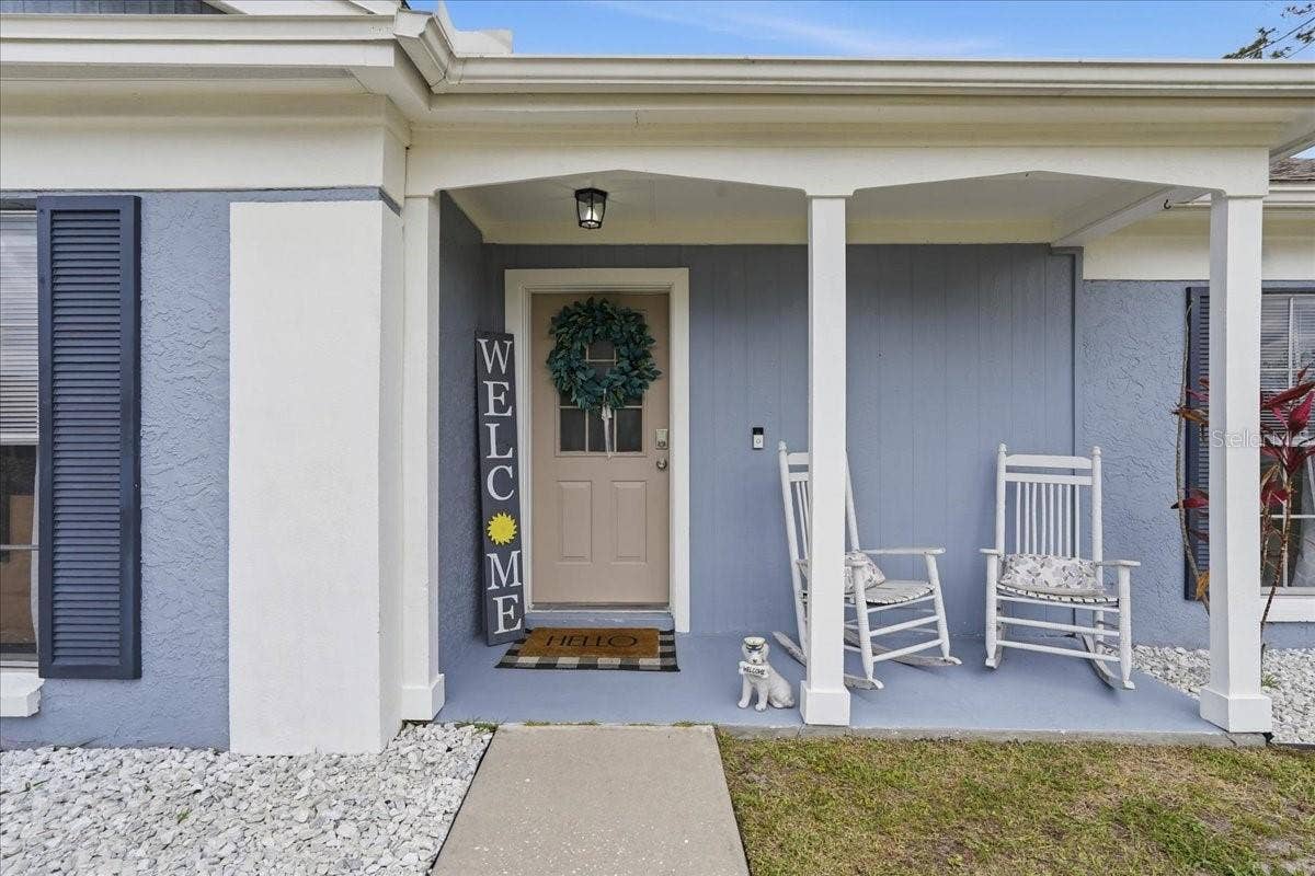 8913 WOOD LAKE COURT, New Port Richey, FL 34653 COVERED ENTRYWAY AND FRONT PORCH