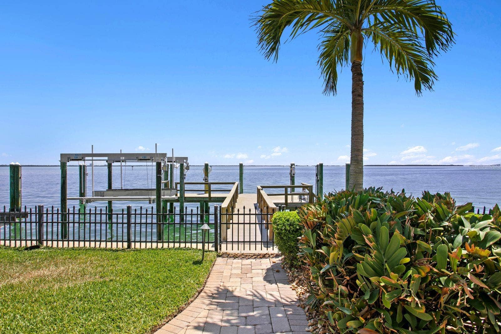 The residence includes a 10,000lb boat lift, a jet ski lift and a generous boat slip.