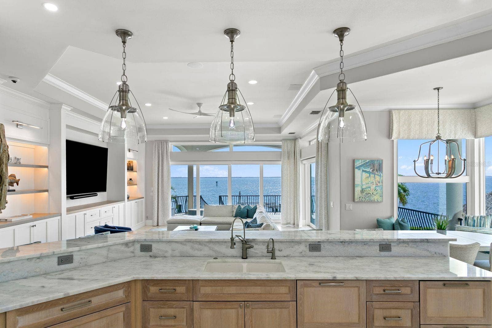 Another breathtaking kitchen view overlooking the stunning waterfront landscape.