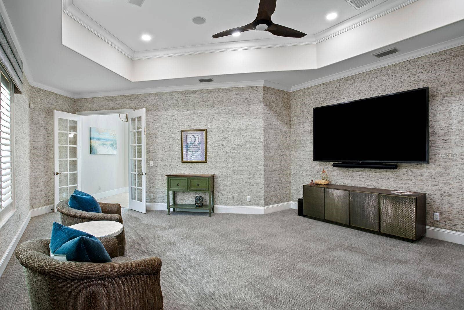 Another view of the social lounge, highlighted by plush luxury carpeting.