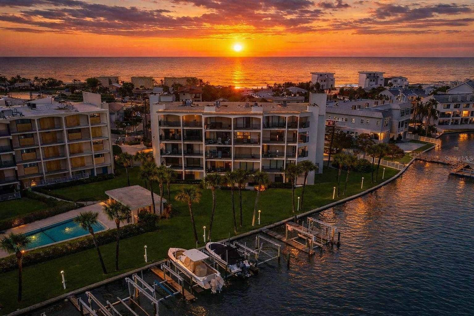 9825 HARRELL AVENUE, #404, Treasure Island, FL 33706 BEST LOCATION ON TREASURE ISLAND! Enjoy breathtaking waterfront views, coastal charm, and easy access to the beach, restaurants, and entertainment
