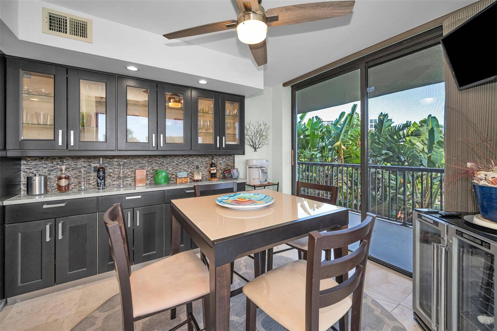1660 GULF BOULEVARD, #208, Clearwater Beach, FL 33767 Dining area with built in Buffet, upper cabinets and Prep Counter