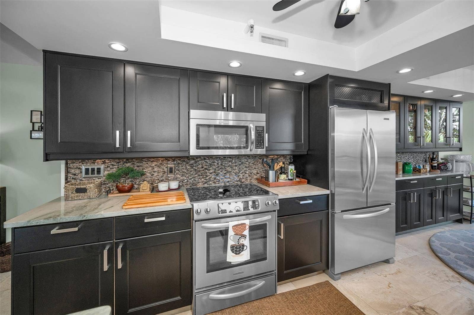 1660 GULF BOULEVARD, #208, Clearwater Beach, FL 33767 Large Kitchen with charcoal cabinets, stainless steel appliances & Quartz countertops