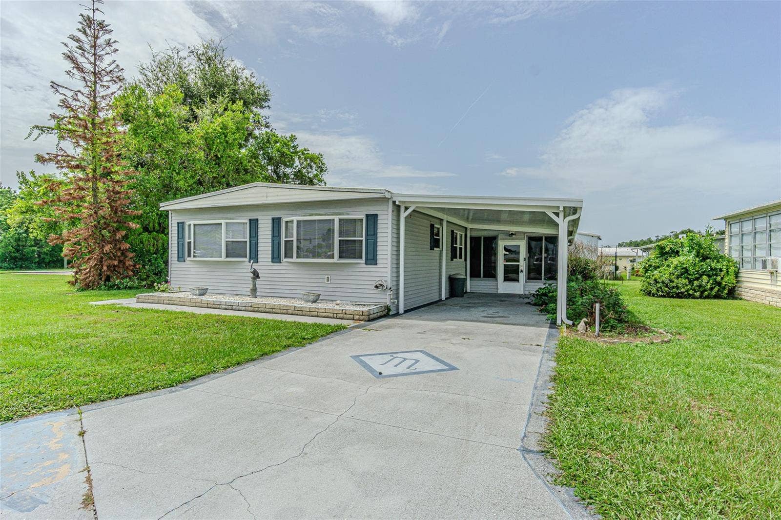 37544 ATTICA AVENUE, Zephyrhills, FL 33542 Welcome Home! OWN your LAND on this spacious lot!