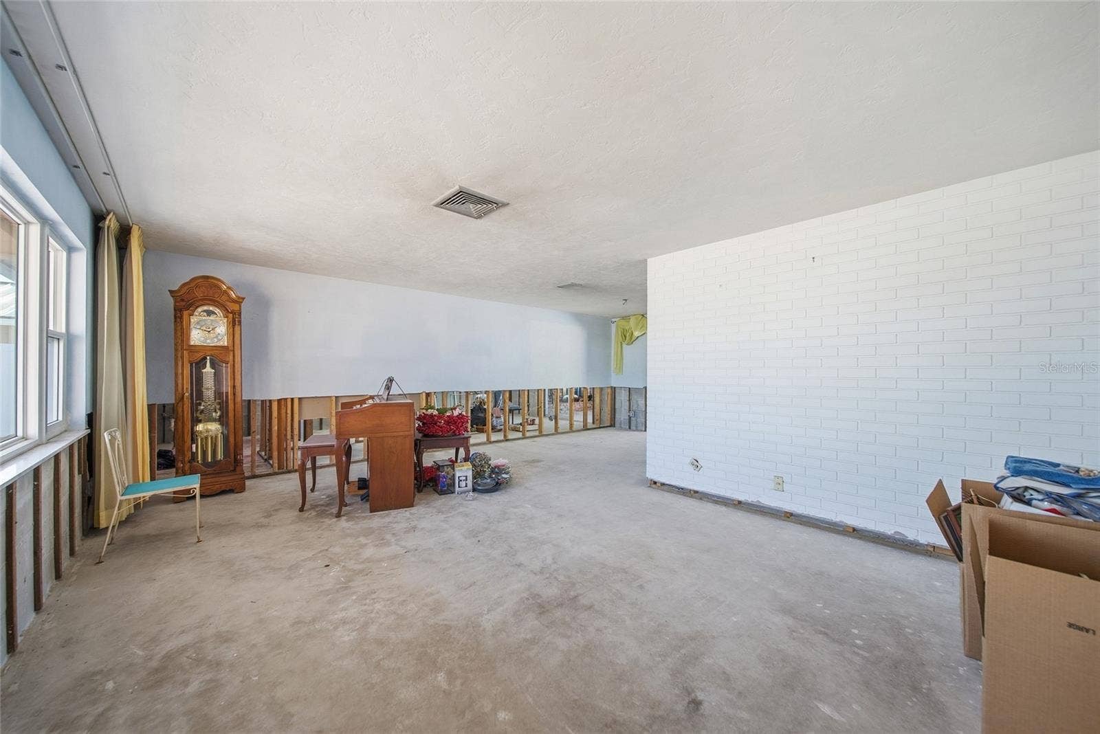 Living in the front of the home to the right of the entry foyer.
