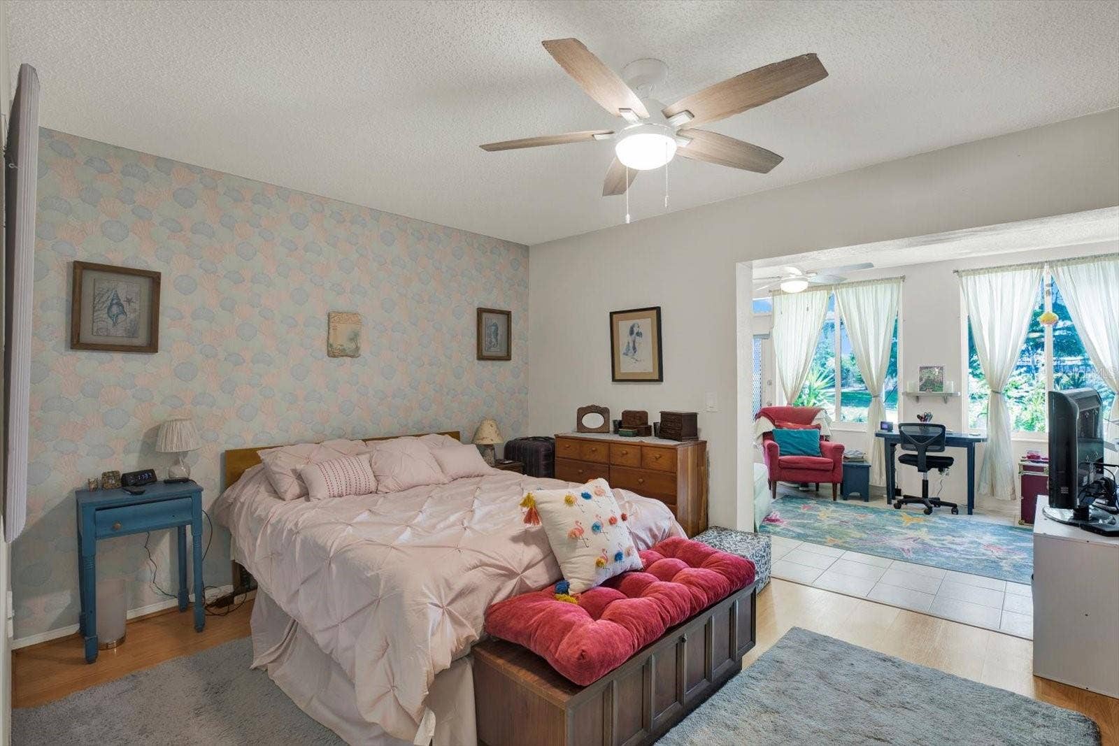 Spacious-Primary-Bedroom-Accent-Wallpaper-Ceiling-Fan-Clearwater-FL