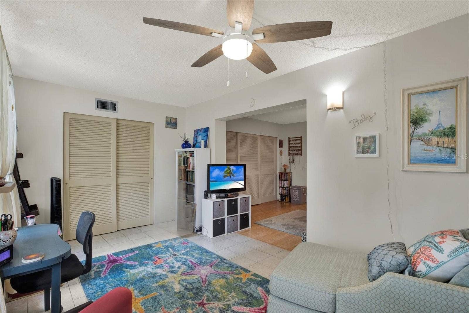 Florida/bonus room with built in closet and garden-facing windows