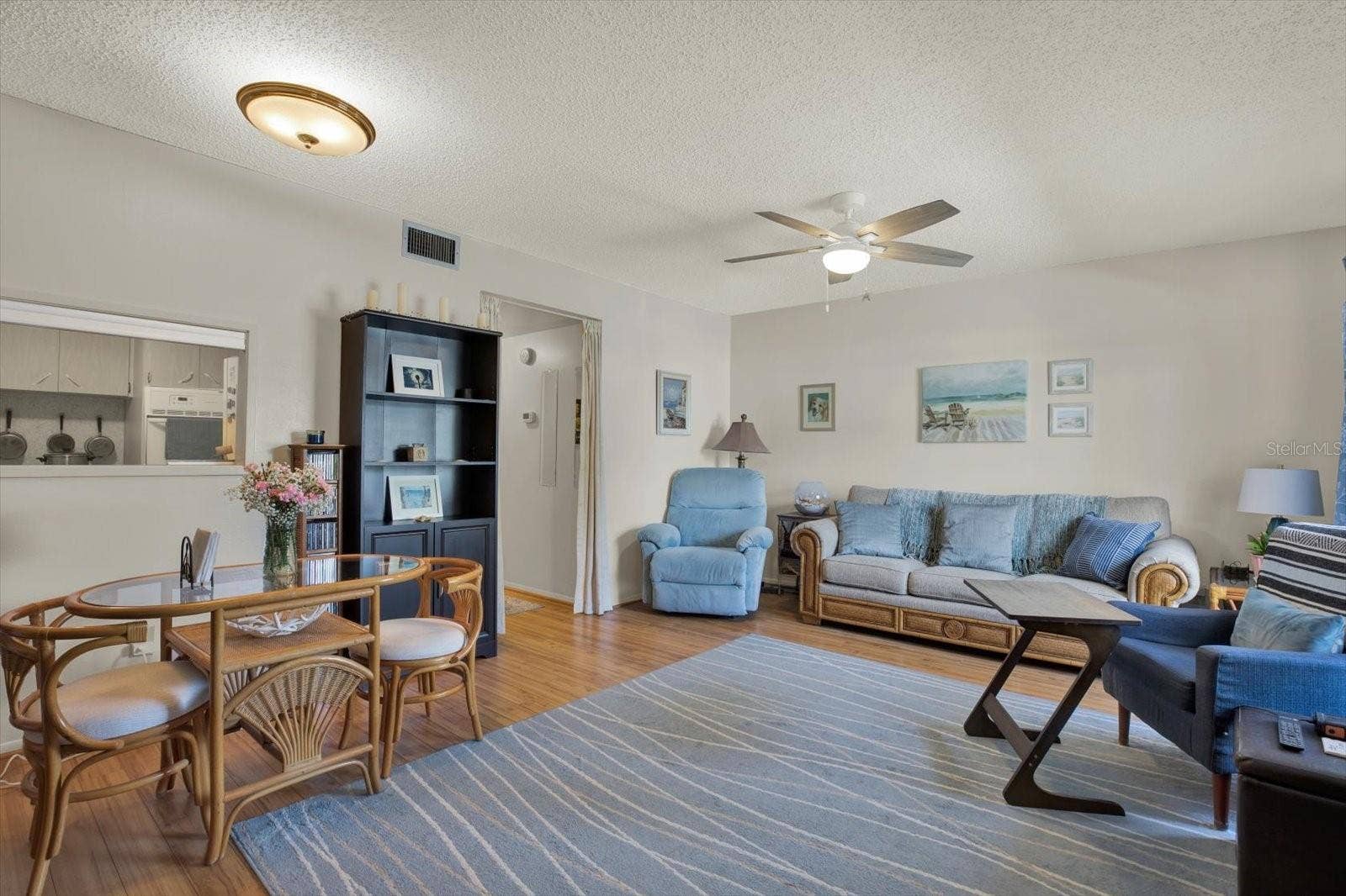 Open-Concept-Living-Dining-Area-Kitchen-Pass-Through-Vinyl-Floors-Clearwater-FL