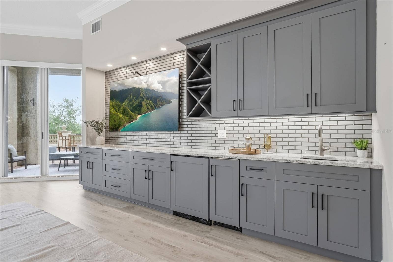 Custom media wall with wet bar, wine storage, and ice maker.