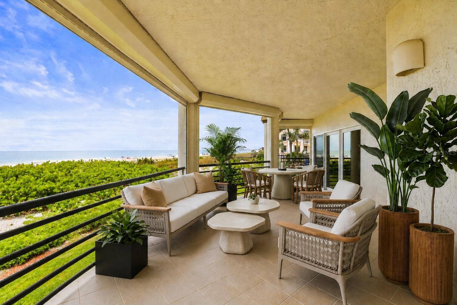 200 121ST AVENUE, #103, Treasure Island, FL 33706 Virtually Stage Balcony