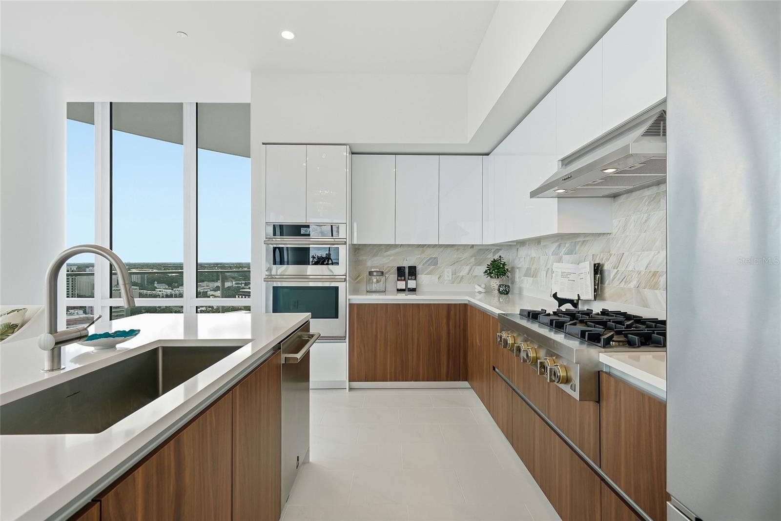 400 CENTRAL AVENUE, #1901, St Petersburg, FL 33701 Premium JennAir appliances, contemporary cabinetry, and a generous gathering island.