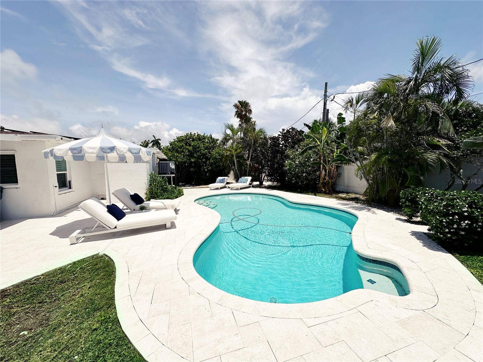 155 112TH AVENUE, #A, Treasure Island, FL 33706 Pool area with pool sweeper