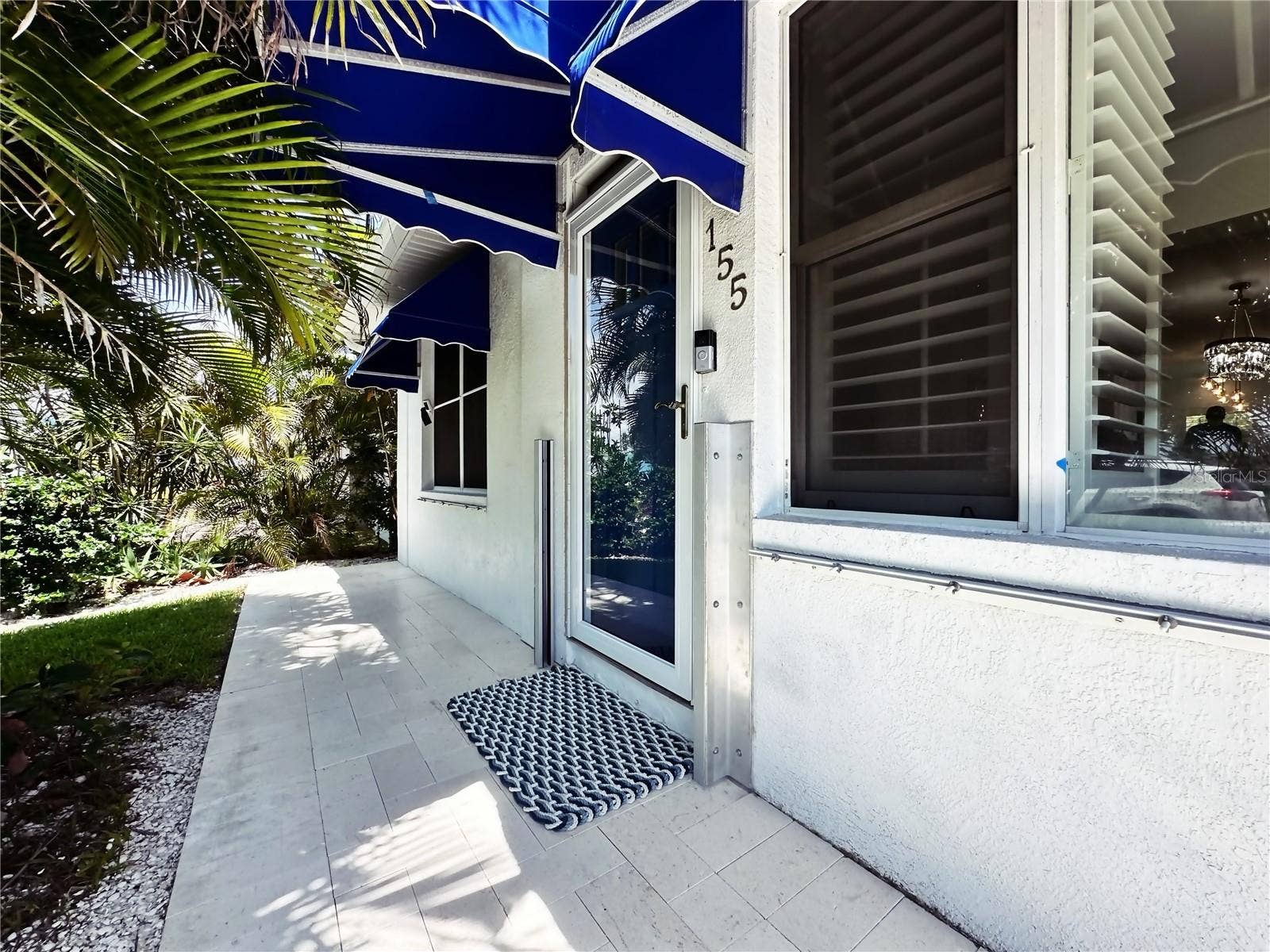 155 112TH AVENUE, #A, Treasure Island, FL 33706 Front entrance. Note the flood gate brackets on the door.
