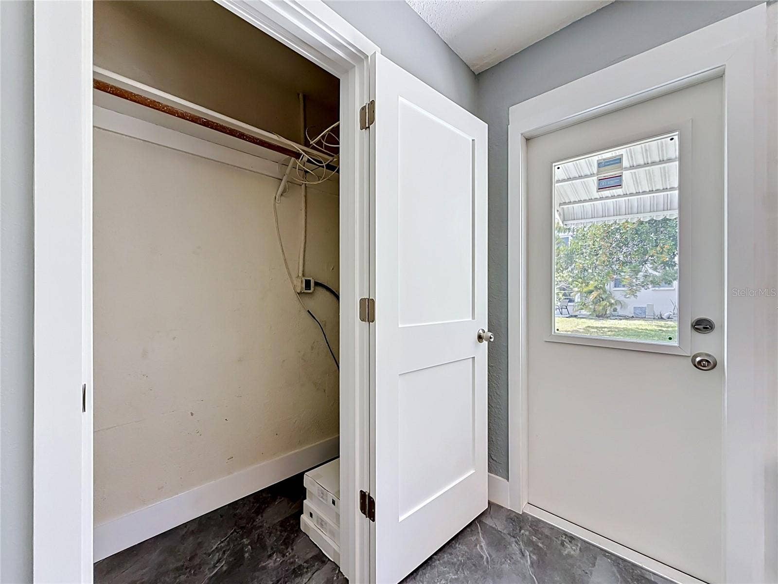 3018 59TH STREET S, #102, Gulfport, FL 33707 Utililty closet in sunroom