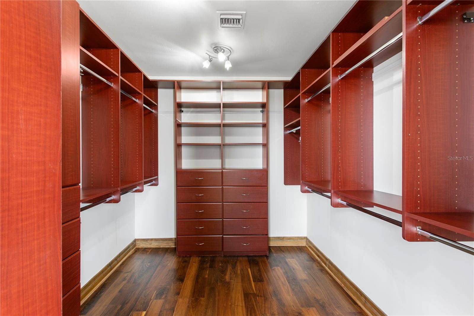 Primary closet  cherry wood built-ins