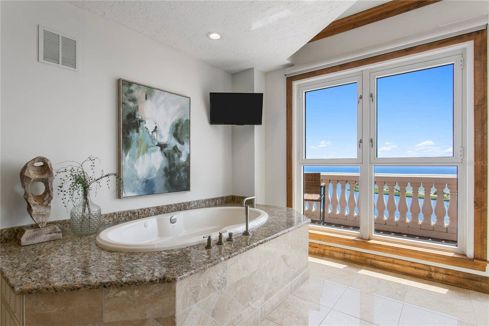 Primary bath  soaking tub with bay view