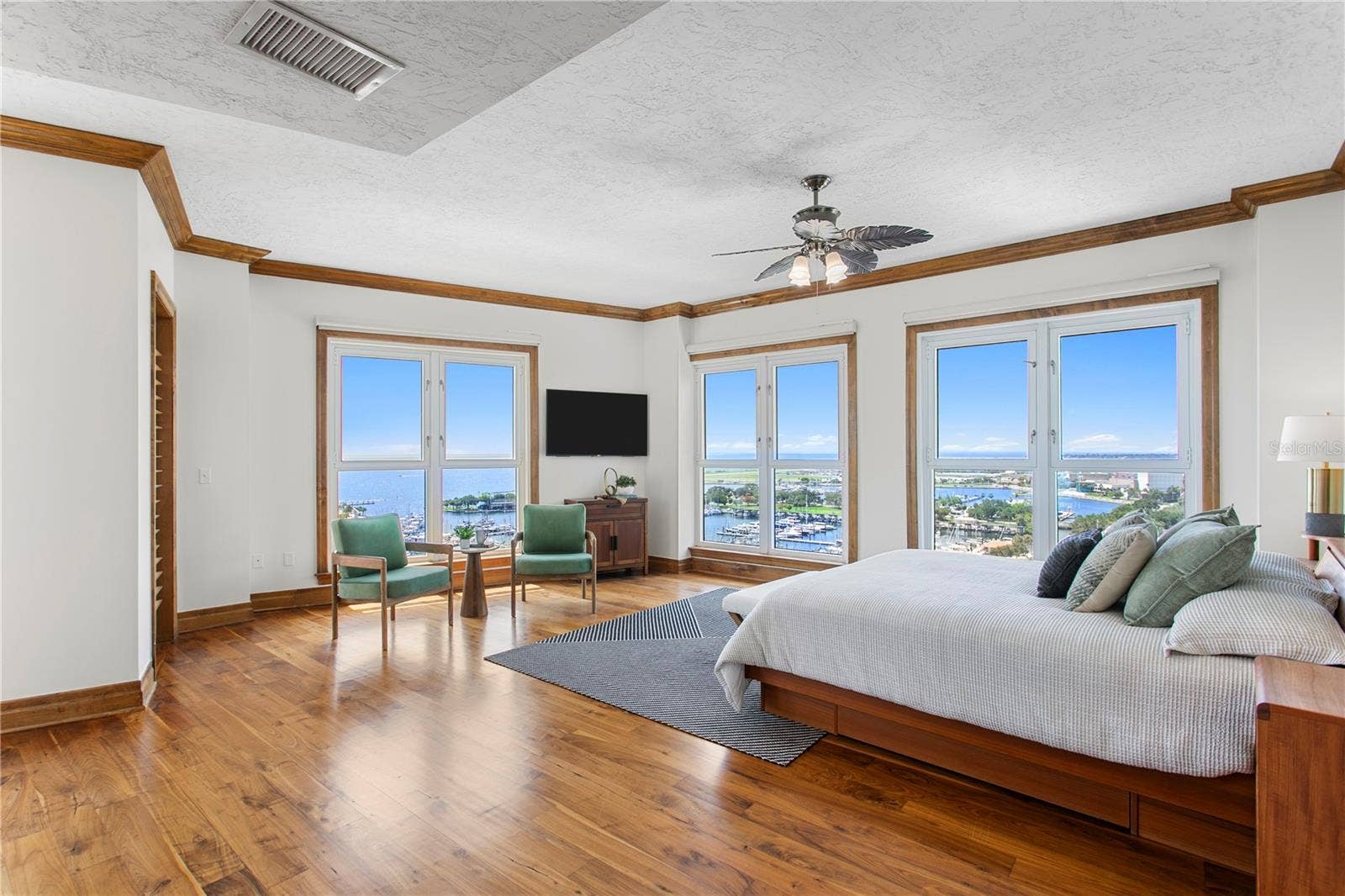 Primary bedroom  wrap around windows, bay views