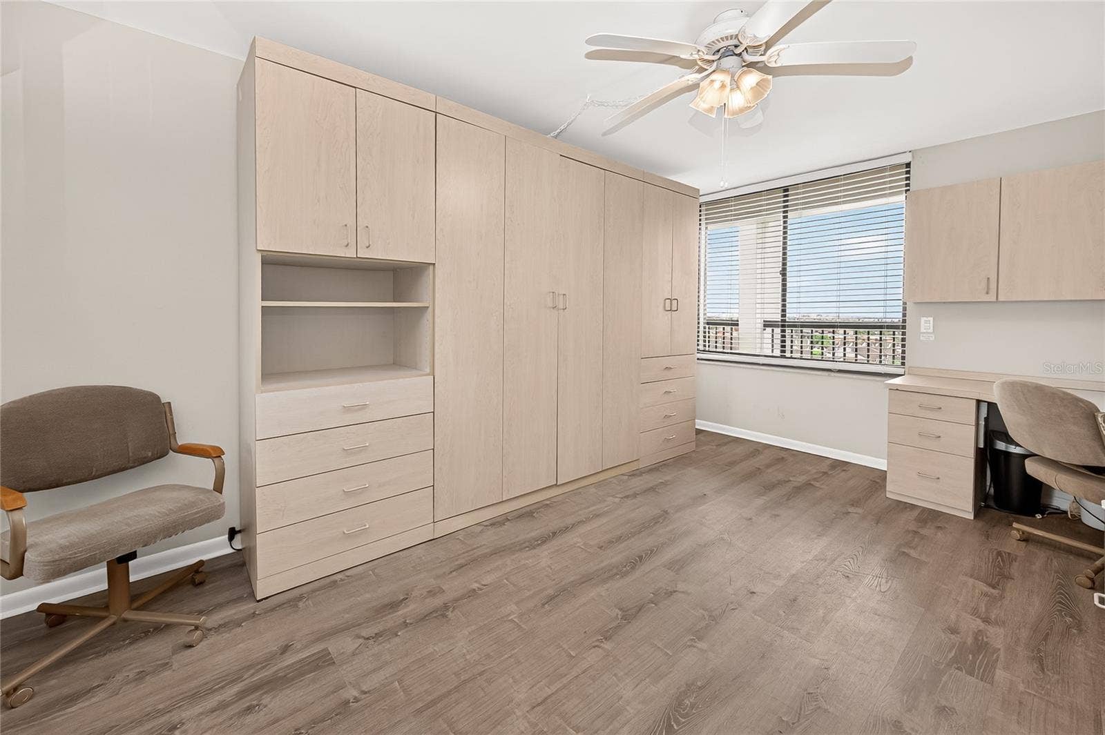 This spacious bedroom has a queen size Murphy Bed - It stays!