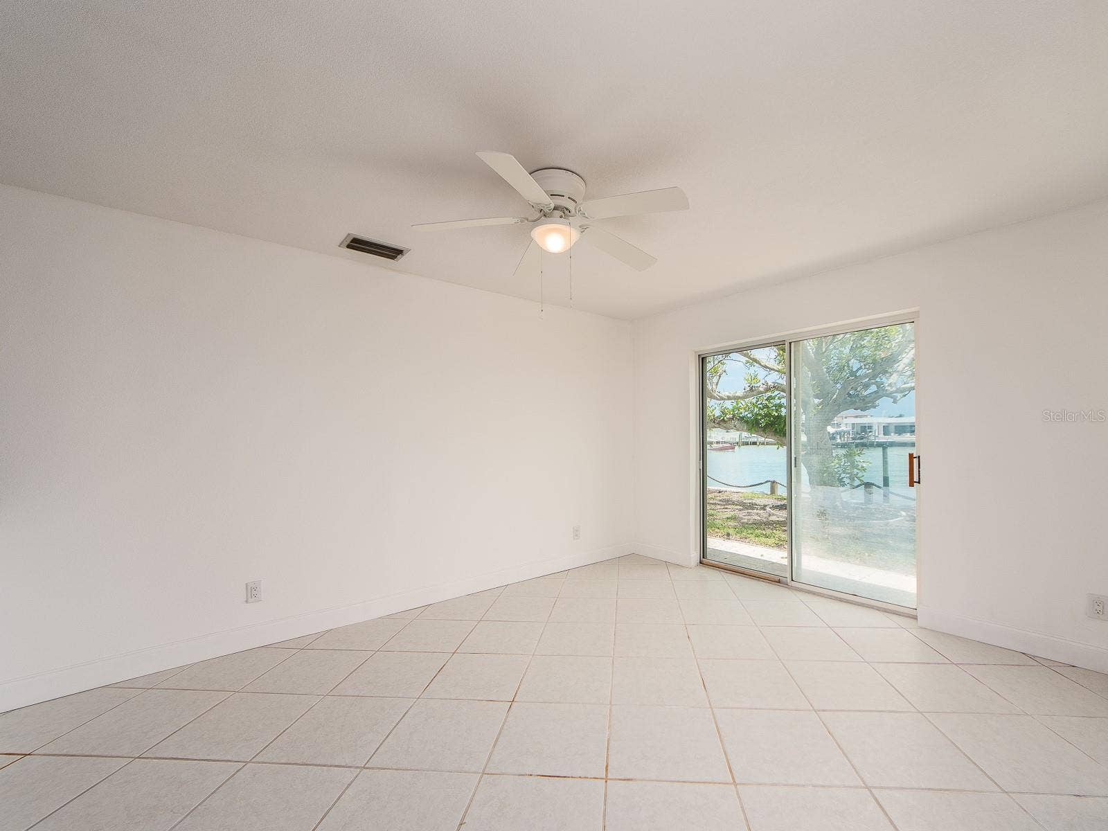 dining area leading to sliding patio doors