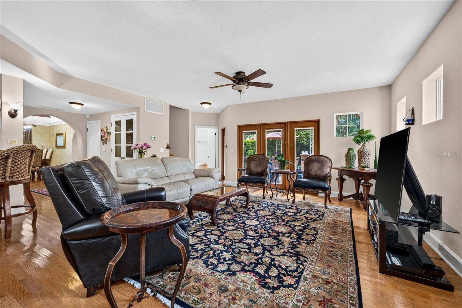 322 ROEBLING ROAD S, Belleair, FL 33756 Living Room With Doors Going Outside
