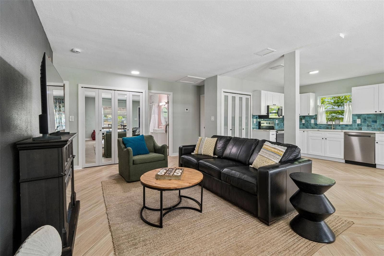 314 INDIANA AVENUE, Crystal Beach, FL 34681 Great room with a double door inside laundry closet in the hall