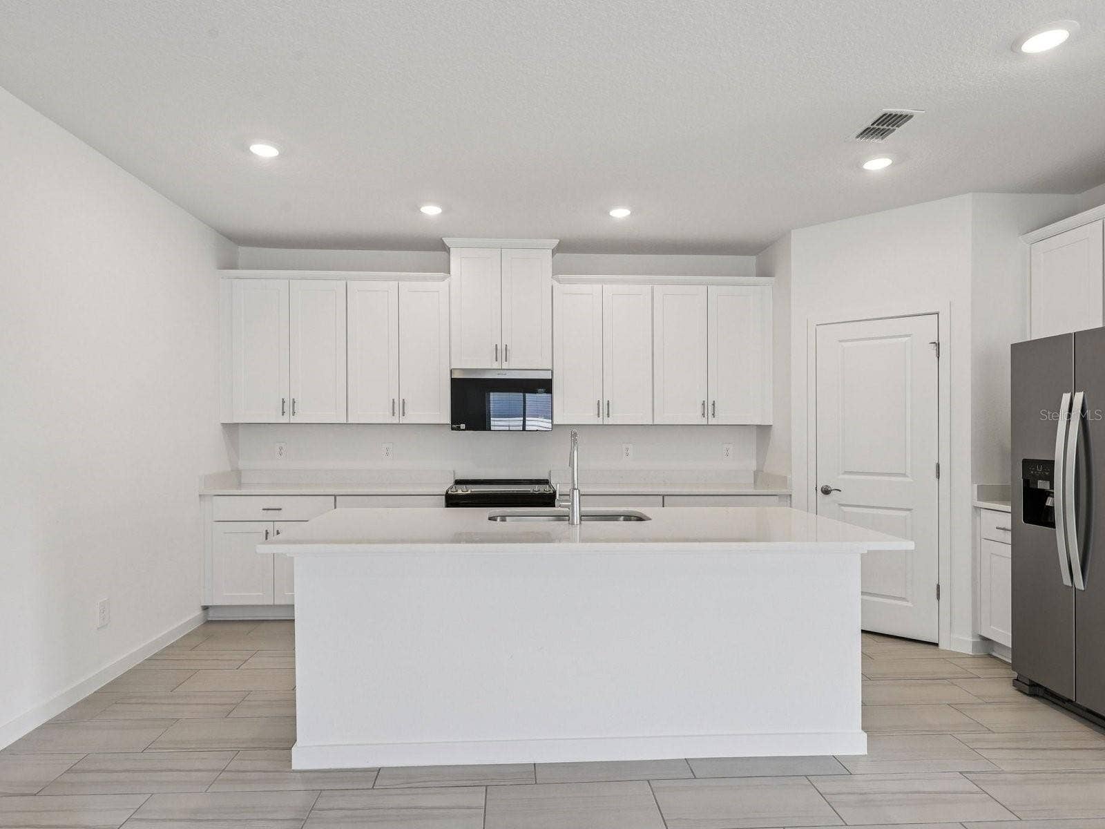 34 GARNI DRIVE, Palm Coast, FL 32137 Photo is not of the actual home, but is an inspirational photo of builders model home and may depict options, furnishings, and/or decorator features that are not included