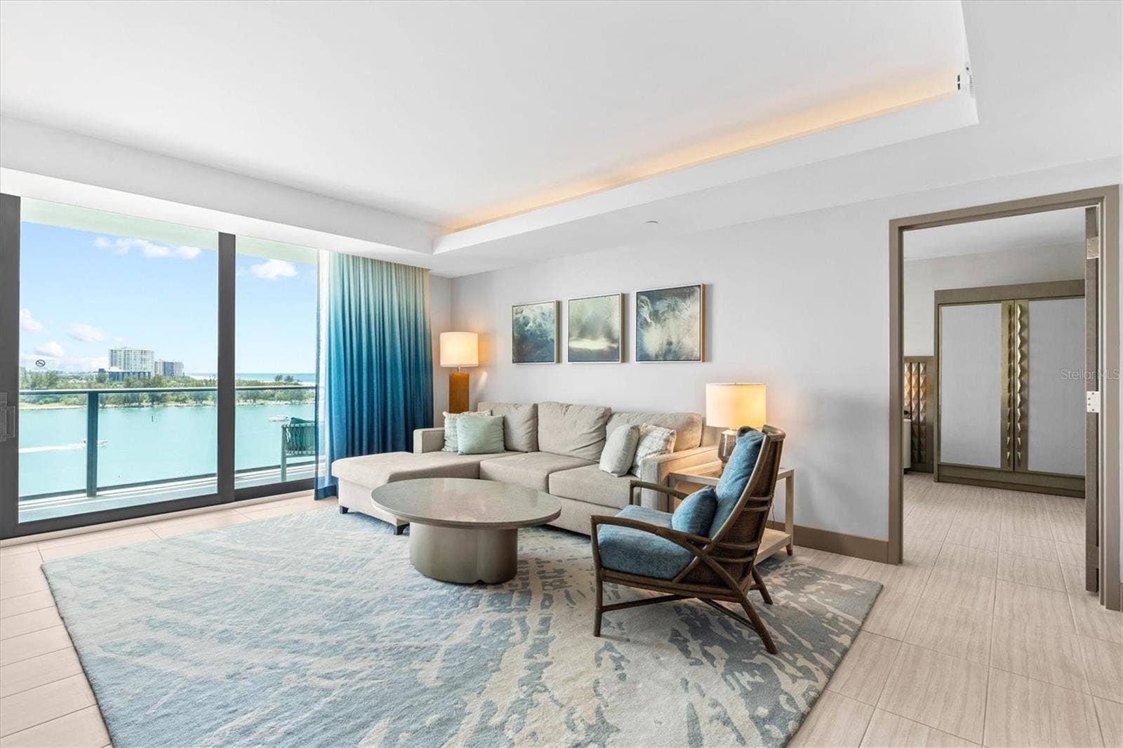 691 S GULFVIEW BOULEVARD, #815, Clearwater Beach, FL 33767 Living area with gorgeous views + pull-out sofa