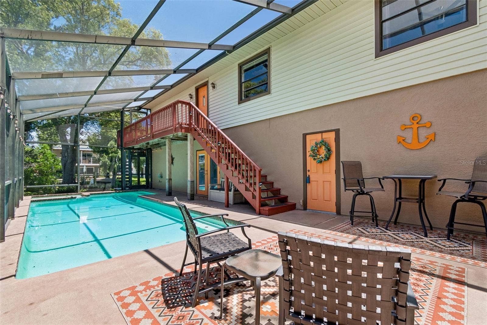 3141 N CANAL DRIVE, Palm Harbor, FL 34684 Fully screened pool and spa area. Access to downstairs bonus room, upstairs living area and garage.