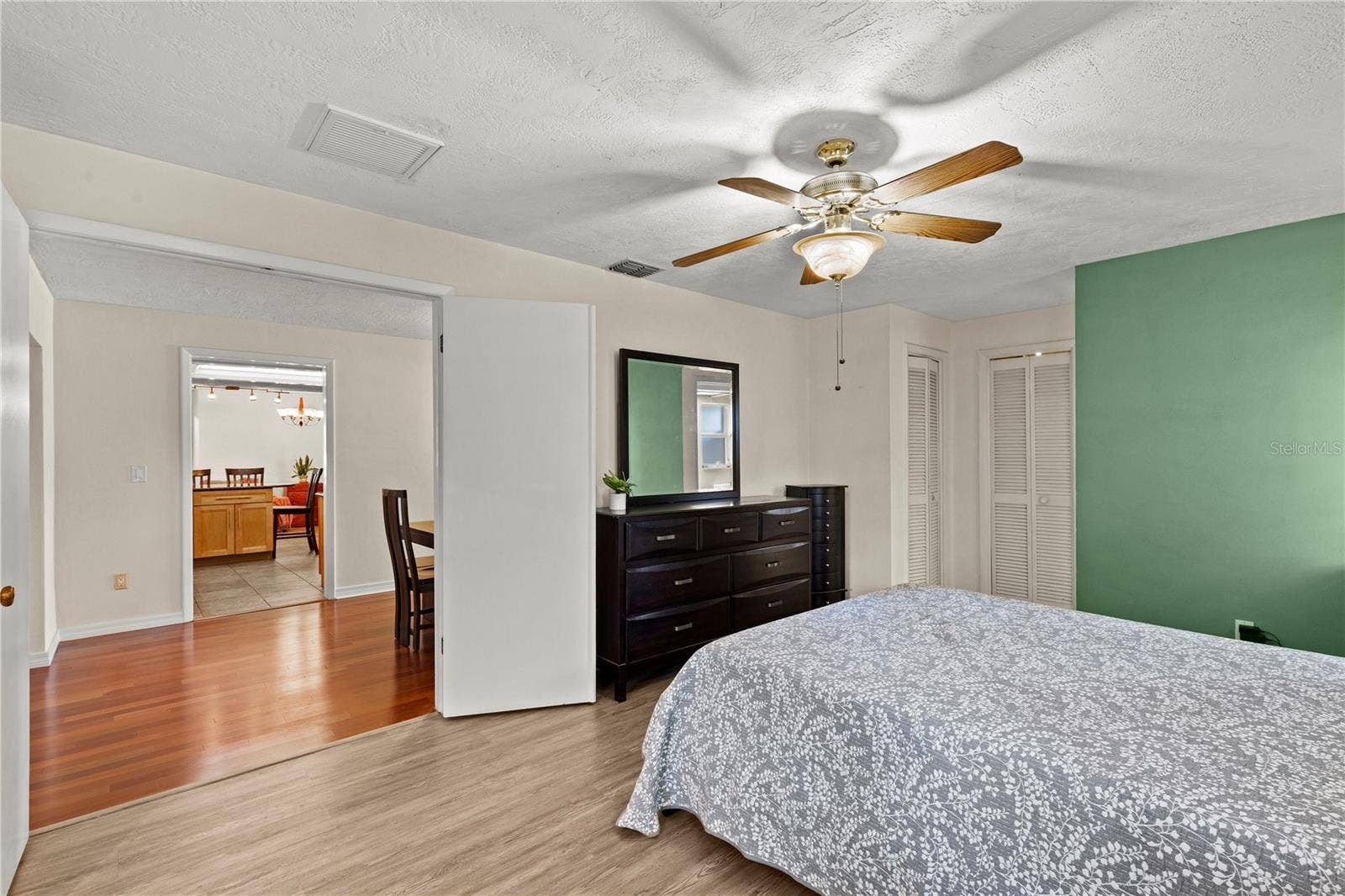 Spacious primary bedroom retreat featuring a bright and airy layout, offering a comfortable and private space to unwind. The room provides ample natural light and a peaceful atmosphere, creating the perfect owners suite for rest and relaxation