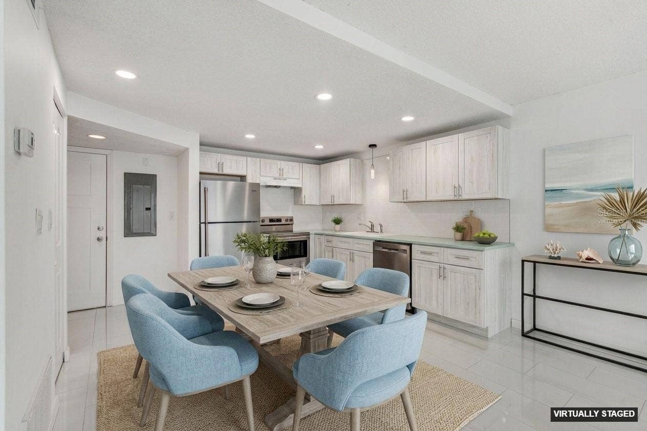 450 TREASURE ISLAND CAUSEWAY, #106, Treasure Island, FL 33706 VIRTUALLY STAGED DINING/LIVING AREA