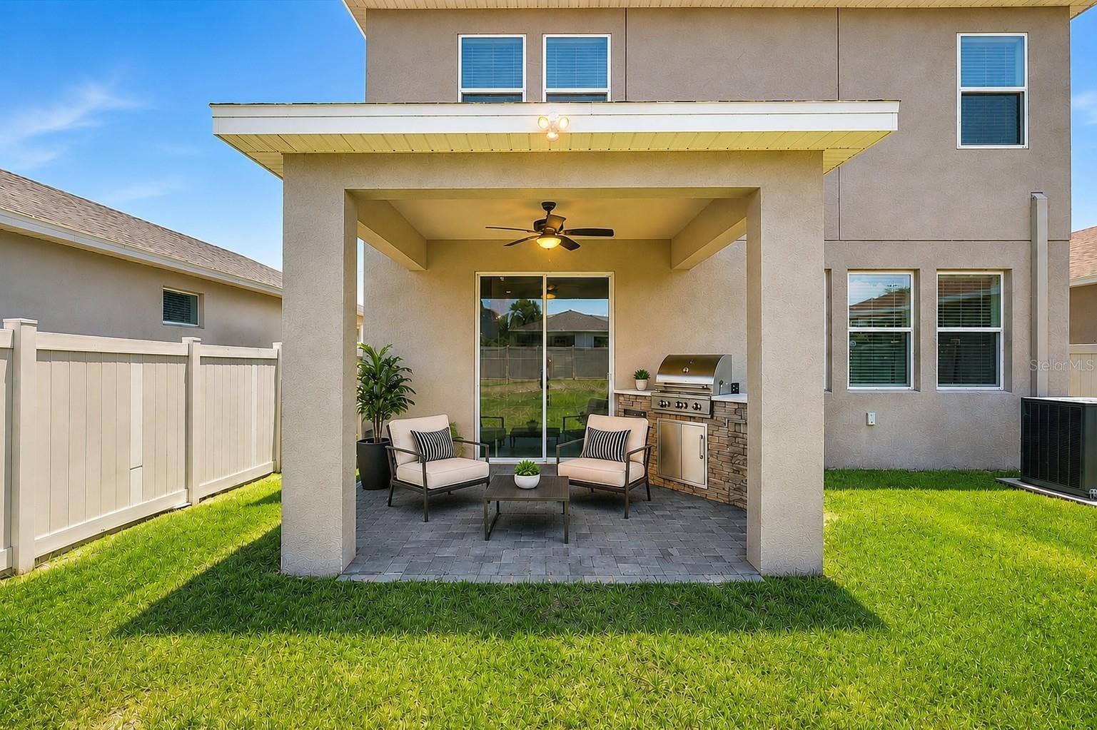 5718 LOS ROBLES COURT, Palmetto, FL 34221 Virtual Staging- Back Covered, Pavered Patio w/ fan