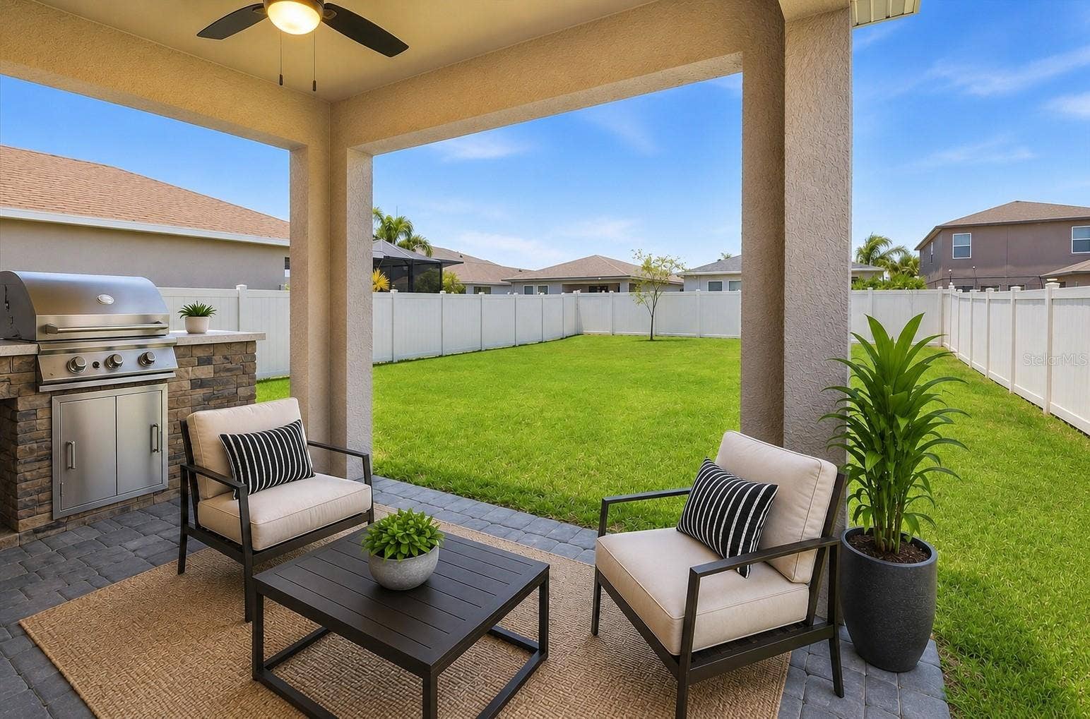 5718 LOS ROBLES COURT, Palmetto, FL 34221 Virtual Staging- Back Covered, Pavered Patio w/ fan