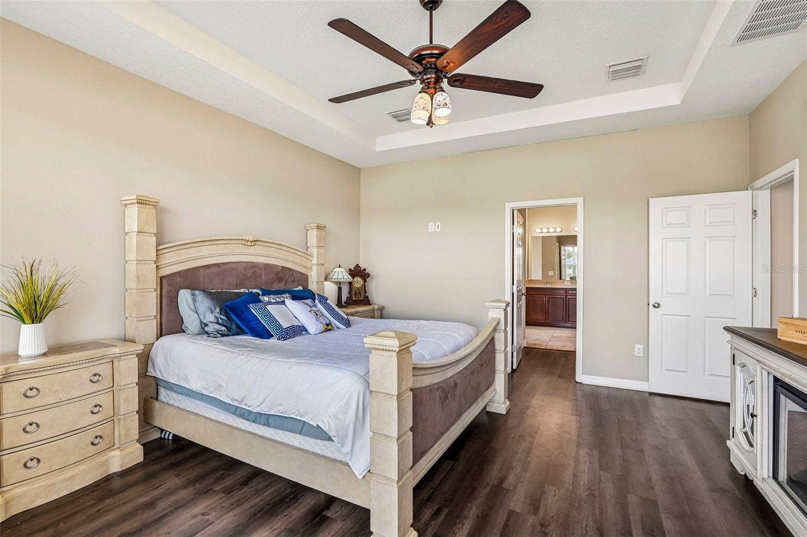 17628 BRIGHT WHEAT DRIVE, Lithia, FL 33547 Primary Bedroom with new laminate flooring, view to the back yard and pond