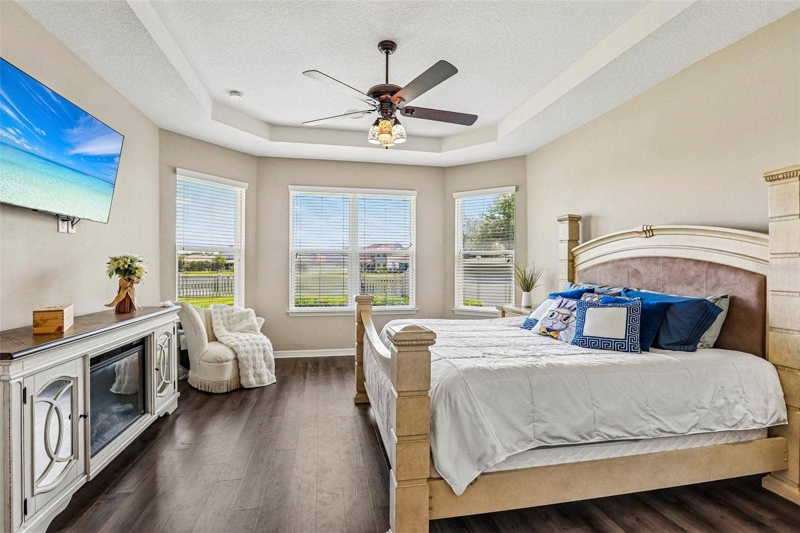 17628 BRIGHT WHEAT DRIVE, Lithia, FL 33547 Primary Bedroom with new laminate flooring, view to the back yard and pond