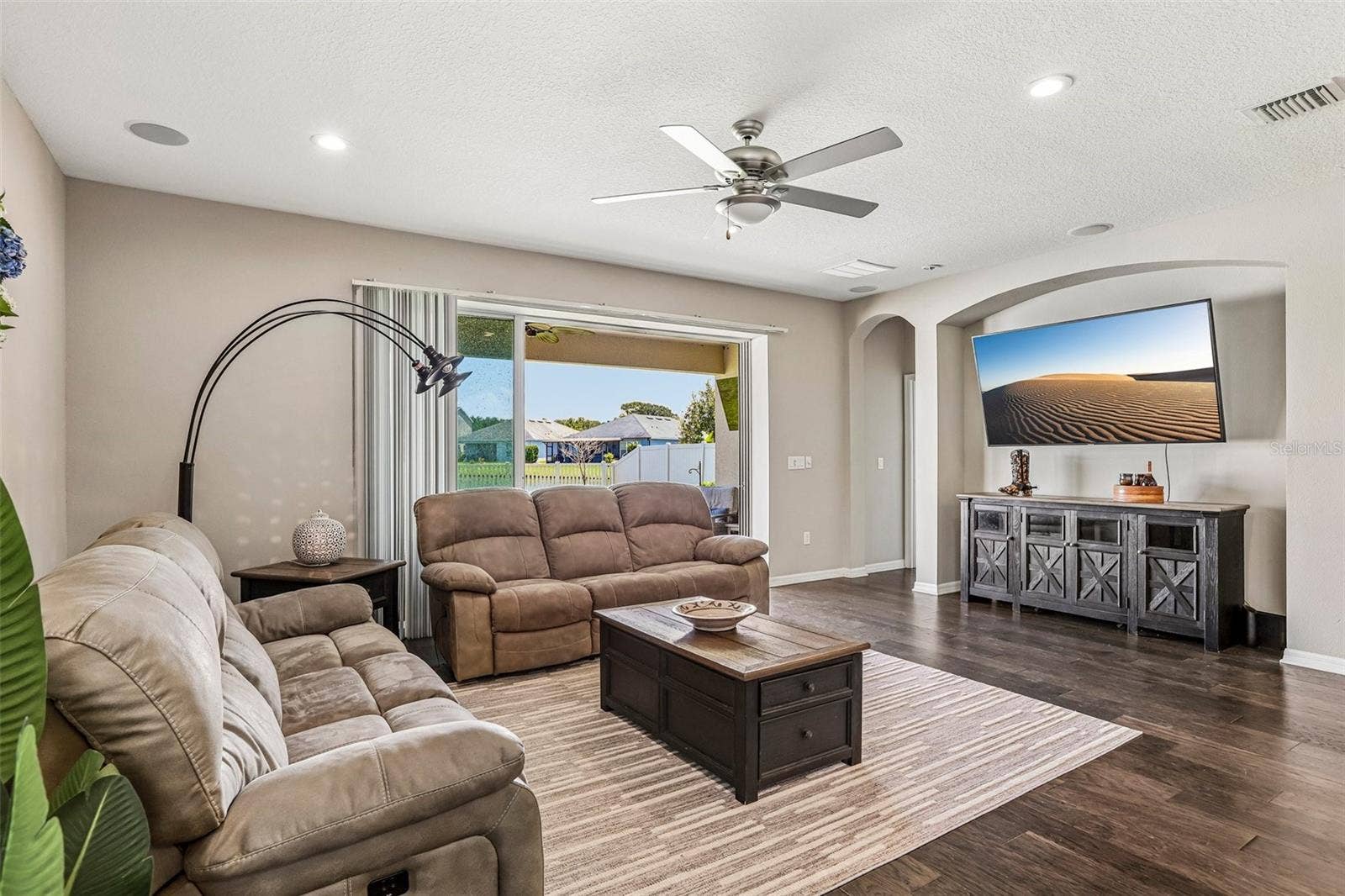 17628 BRIGHT WHEAT DRIVE, Lithia, FL 33547 Family Room with beautiful hard wood floors, neutral colors, sliders to the back yard and open to the kitchen