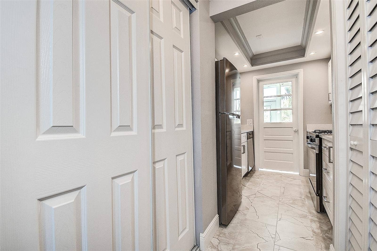 1819 SHORE DRIVE S, #110, South Pasadena, FL 33707 Kitchen Entry w/ Pantry/Storage Closets