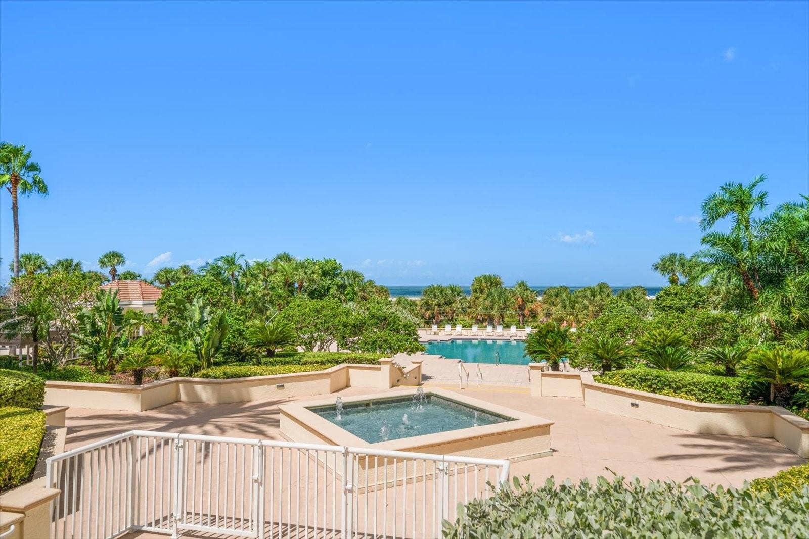 1170 GULF BOULEVARD, #404, Clearwater Beach, FL 33767 Expansive pool & spa deck offer room for all to soak up the sun at The Grande.