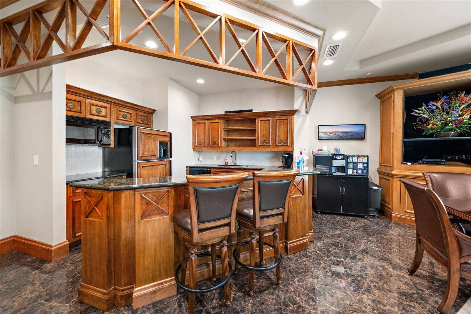 1170 GULF BOULEVARD, #404, Clearwater Beach, FL 33767 The perfect spot for an afternoon beverage or a indulging night cap without ever leaving the building. Gather friends or family to share a sip at "home"